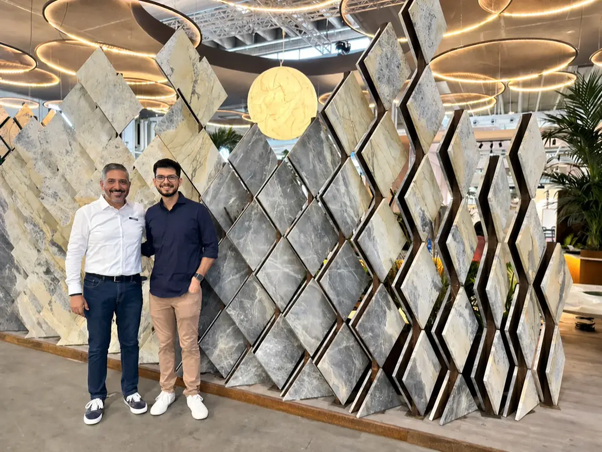 GEMS representatives visiting a geometric natural stone exhibit at Marmomac